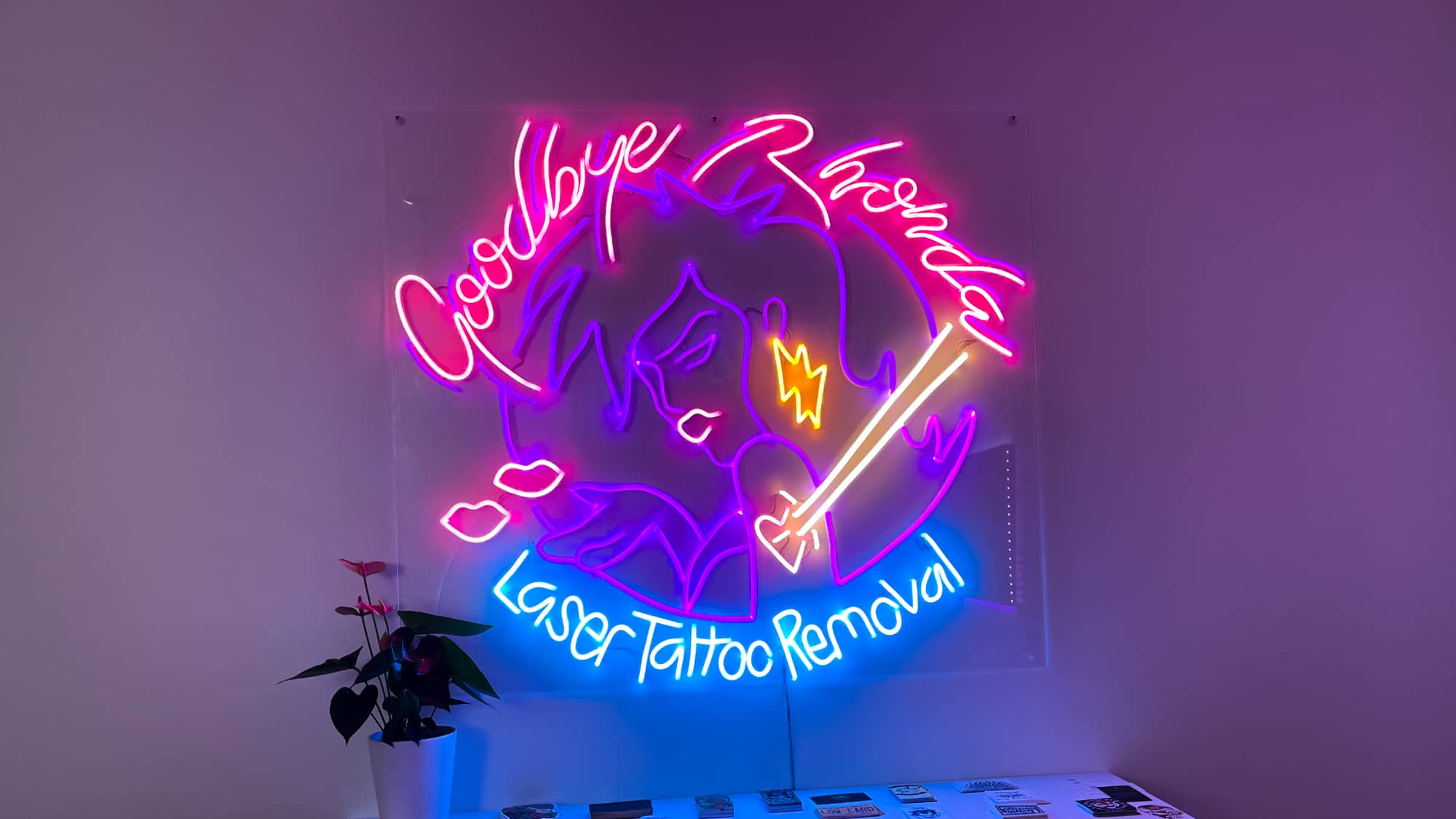 Pink neon lips sign at Goodbye Rhonda